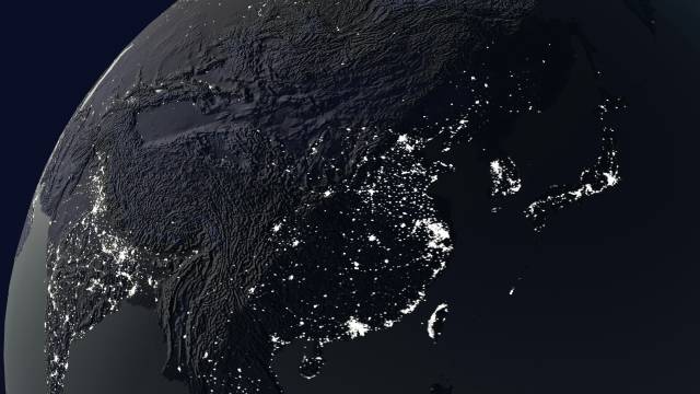Outline of China on the globe at night with city lights.