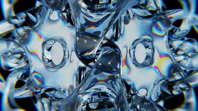 An abstract image depicting translucent material similar to crystal reflecting on itself in hues of blue, silver and black 