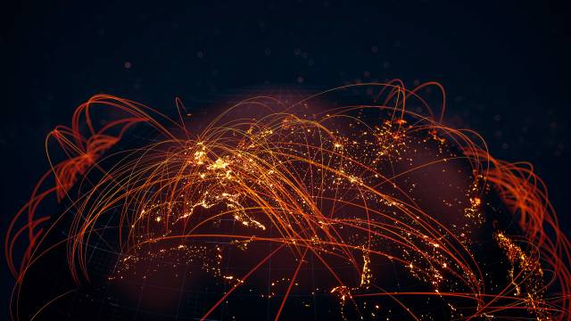 A glowing globe covered by orange - red sparks representing information flows.